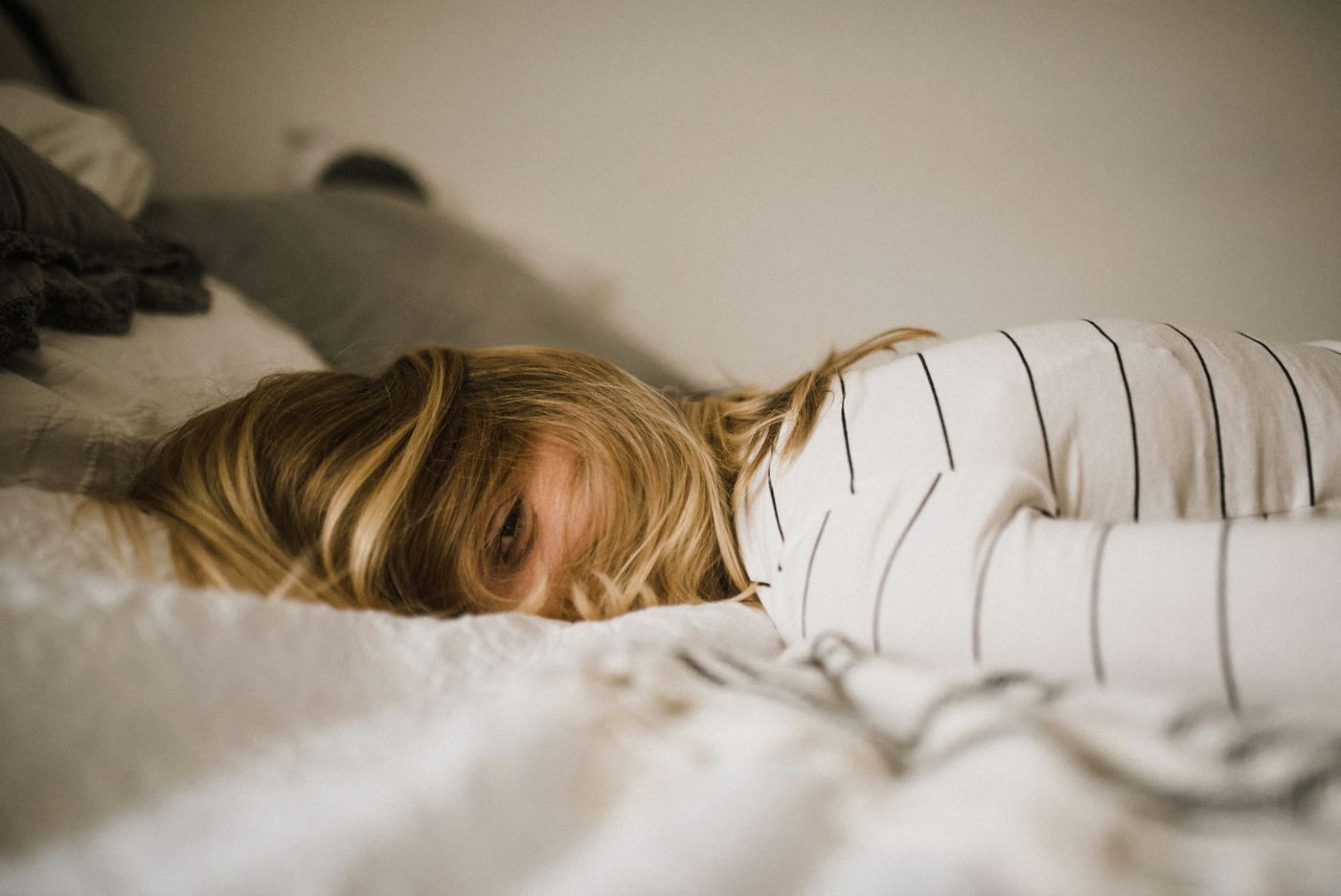 Woman resting on a bed